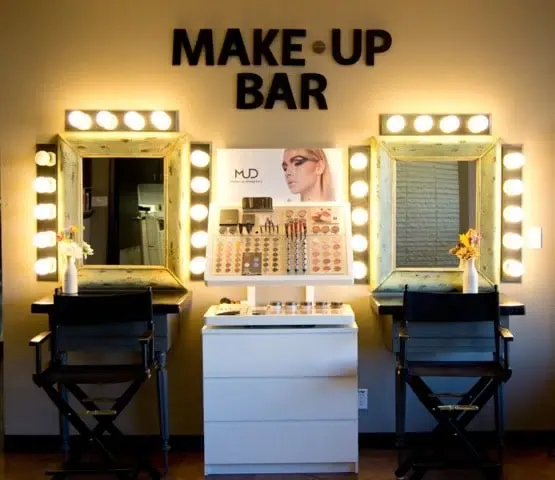 The marquee-lit MAKE-UP BAR wall at the Salina campus